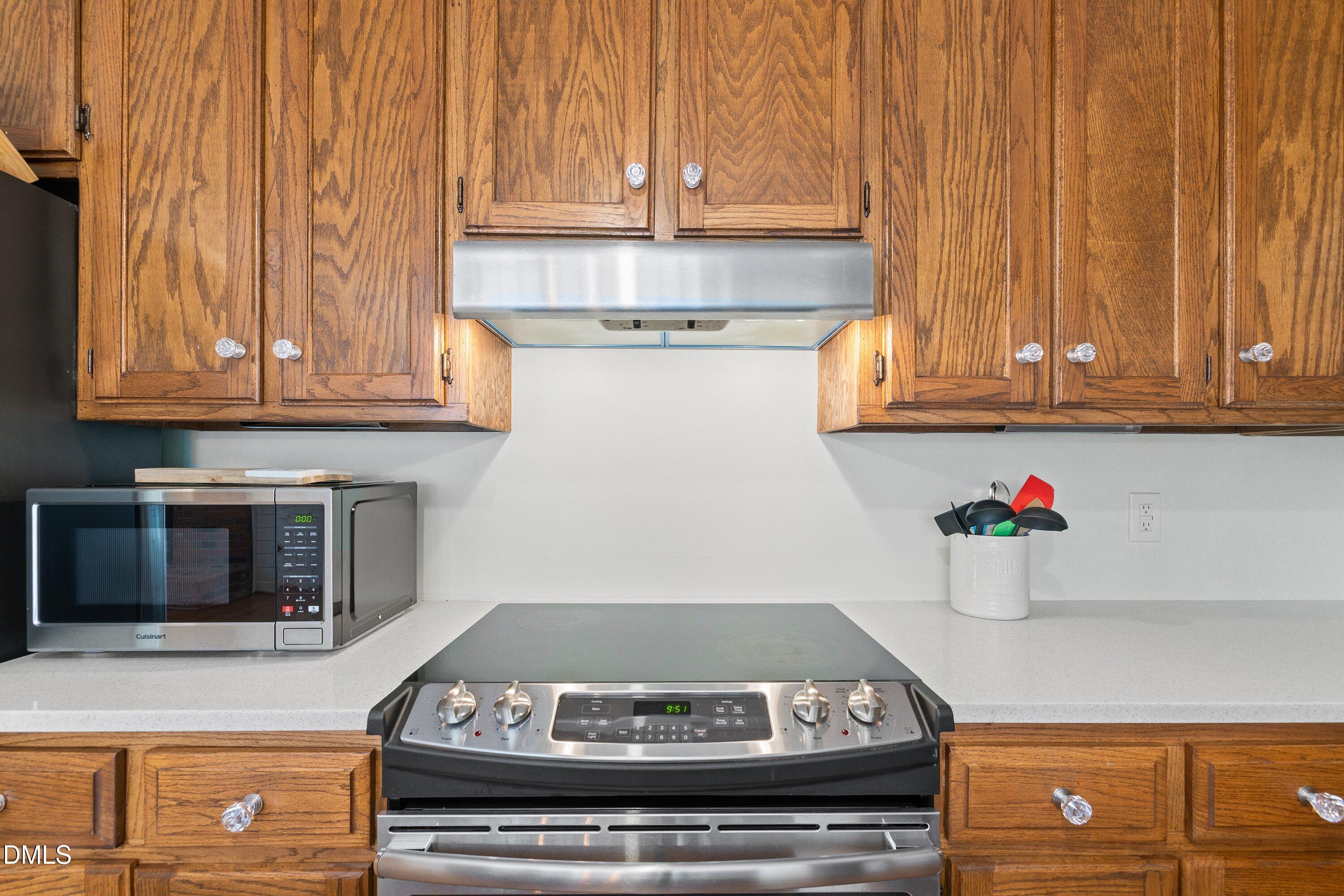 2500 Cravenridge Road Garner, NC 27529 - Photo 15 of 52 a stove top oven sitting inside of a kitchen