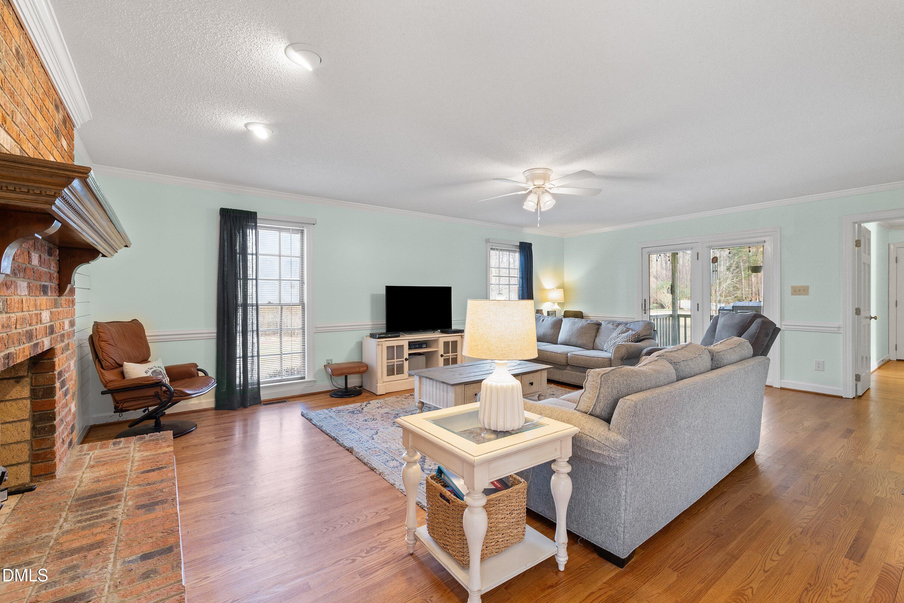 2500 Cravenridge Road Garner, NC 27529 - Photo 18 of 52 a living room with furniture and a flat screen tv