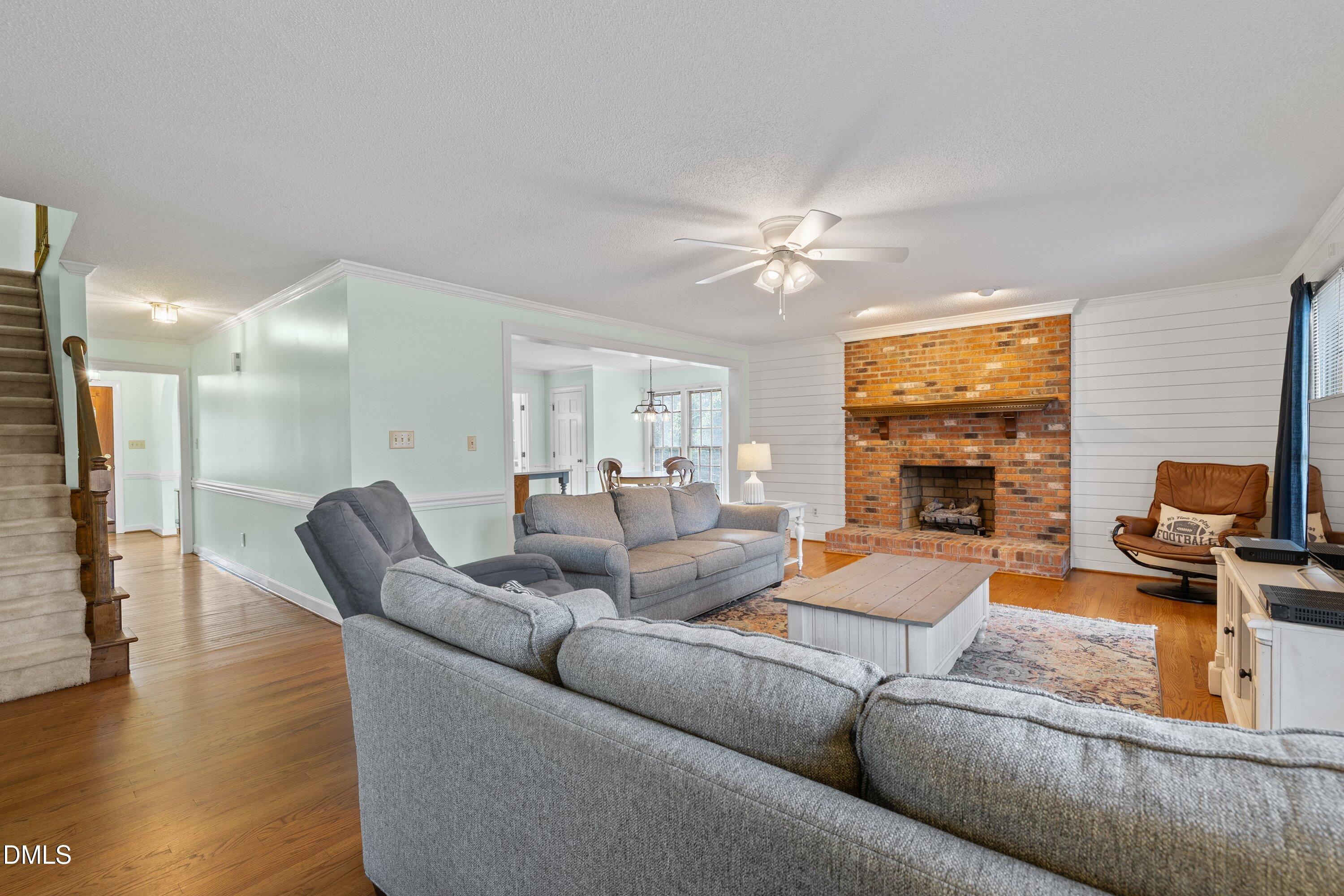 2500 Cravenridge Road Garner, NC 27529 - Photo 20 of 52 a living room with furniture and a flat screen tv