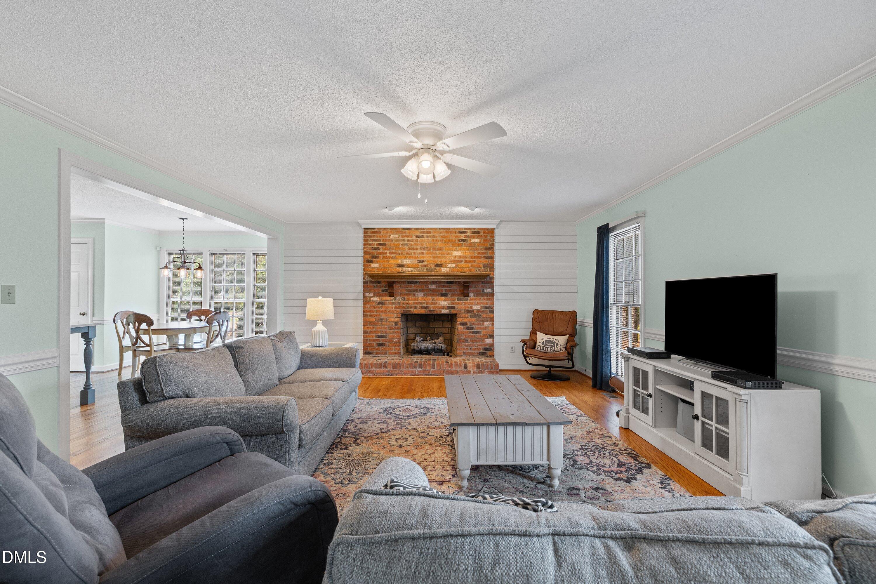 2500 Cravenridge Road Garner, NC 27529 - Photo 21 of 52 a living room with furniture and a flat screen tv