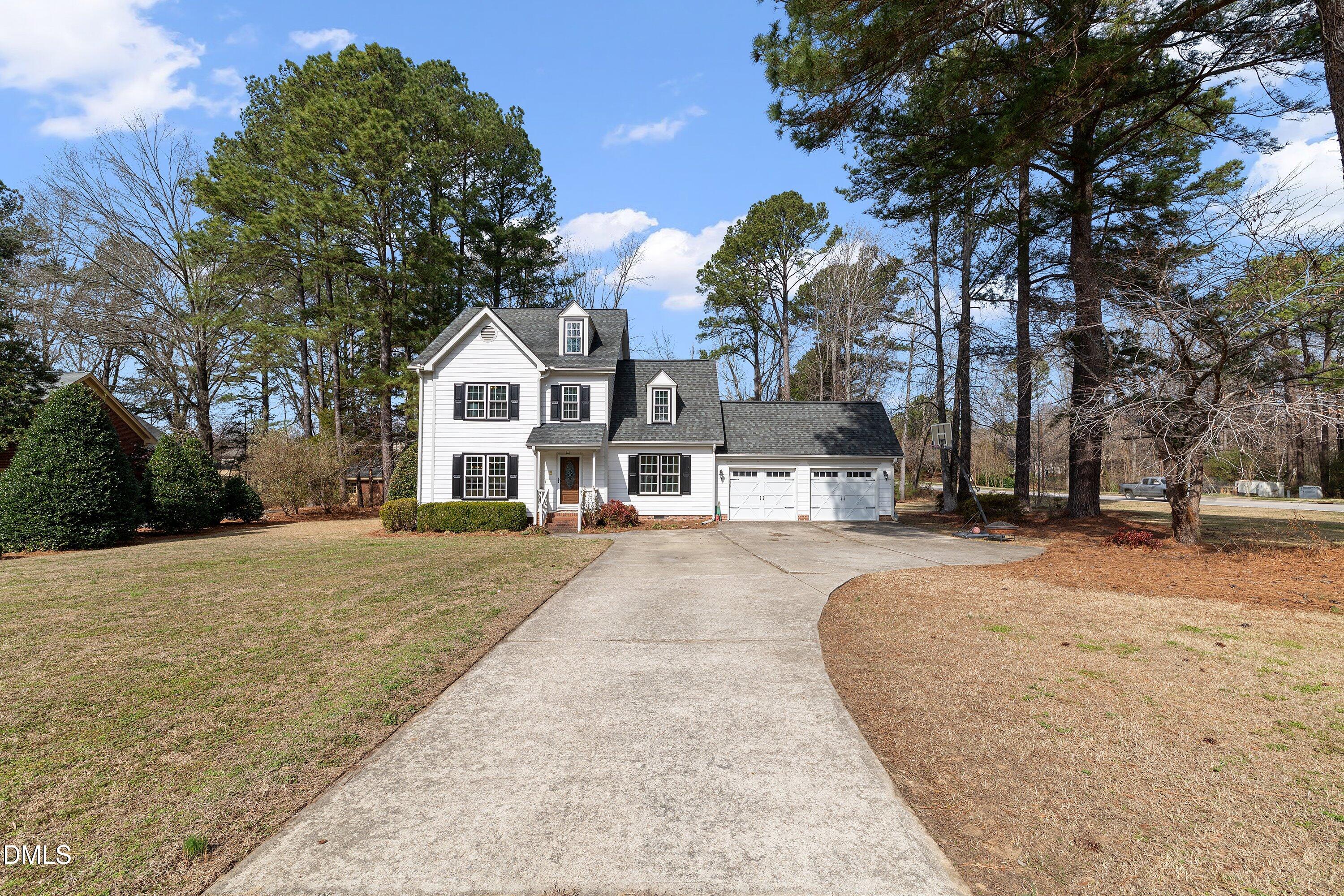 2500 Cravenridge Road Garner, NC 27529 - Photo 2 of 52 a front view of a house with a yard and garage