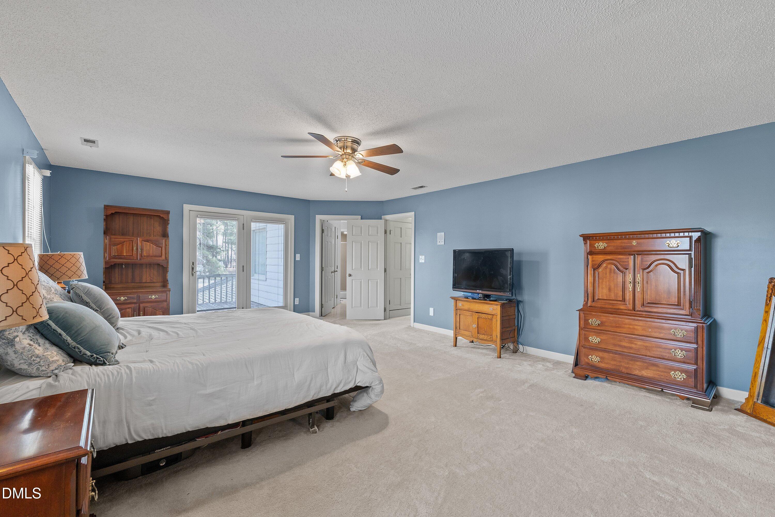 2500 Cravenridge Road Garner, NC 27529 - Photo 36 of 52 a bedroom with a bed and dresser