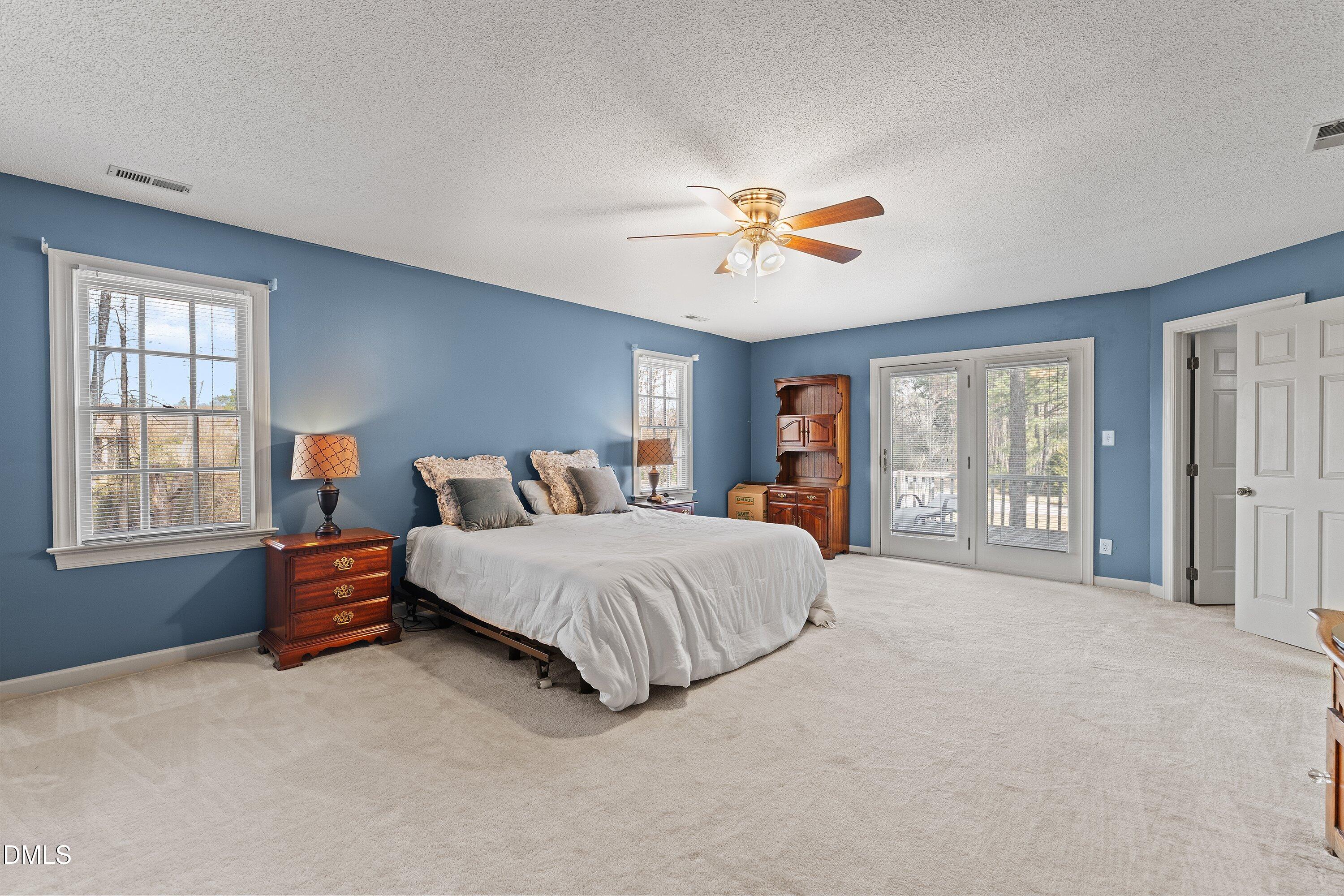 2500 Cravenridge Road Garner, NC 27529 - Photo 37 of 52 a spacious bedroom with a large bed and a window
