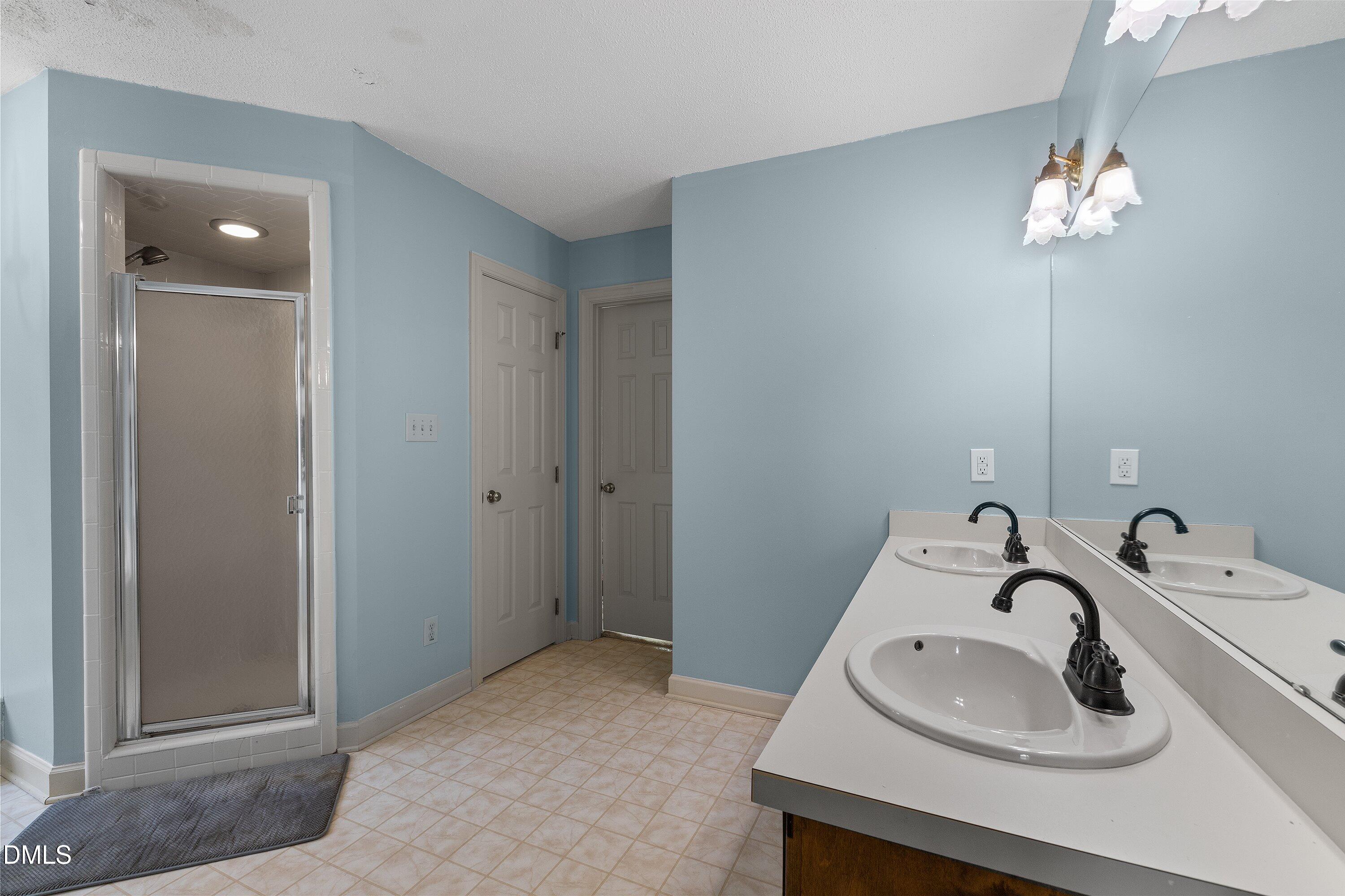 2500 Cravenridge Road Garner, NC 27529 - Photo 38 of 52 a bathroom with a sink and a mirror