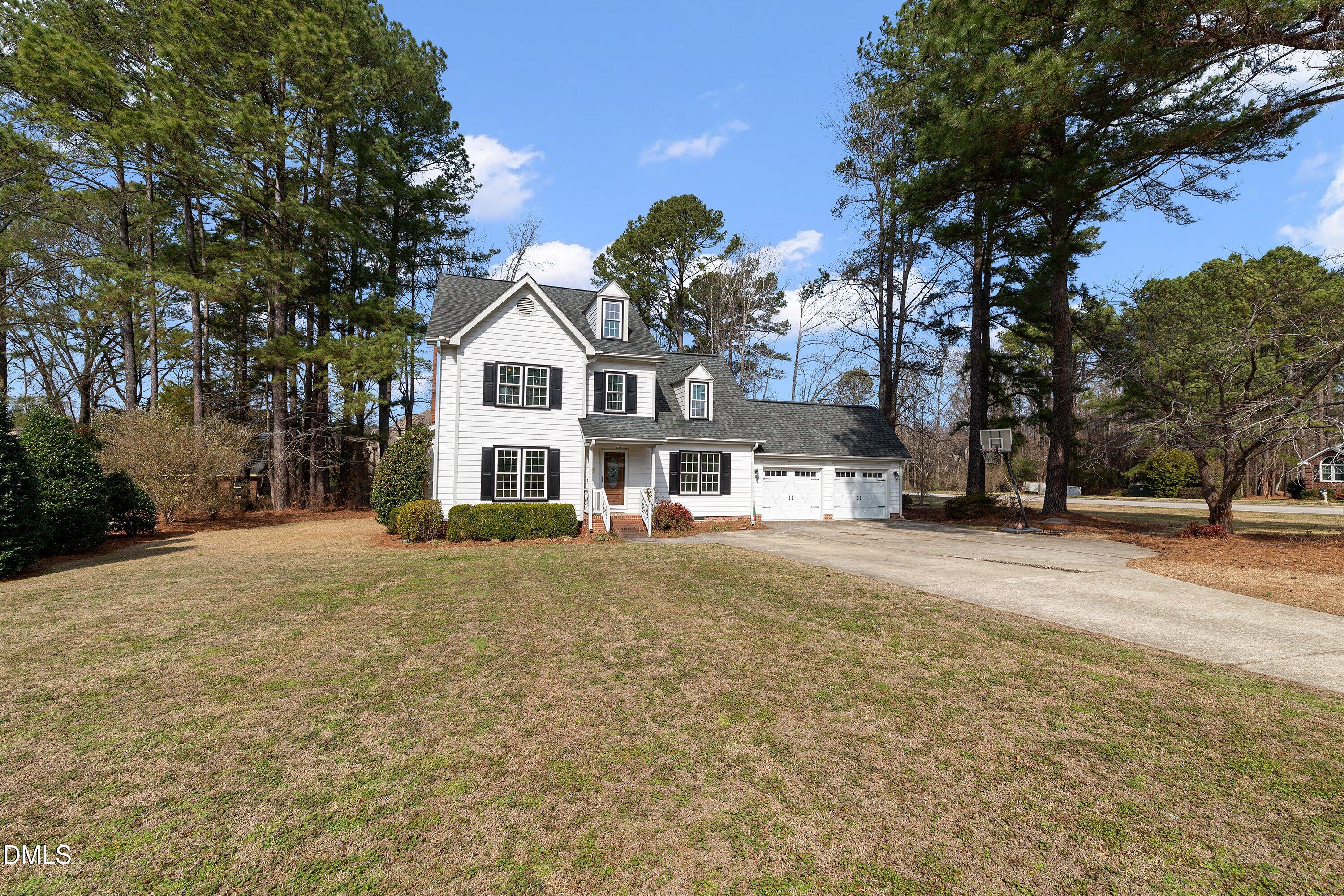 2500 Cravenridge Road Garner, NC 27529 - Photo 3 of 52 a front view of a house with a yard and garage