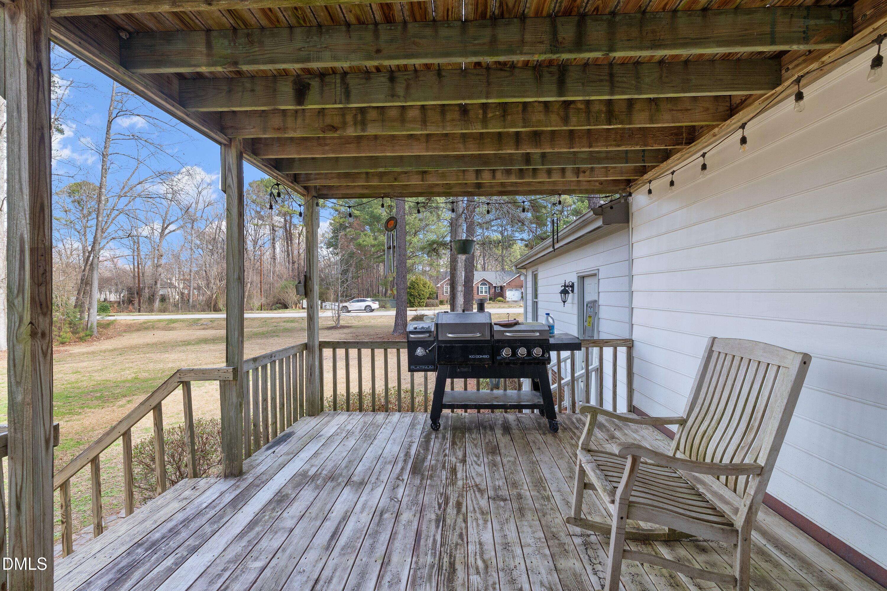 2500 Cravenridge Road Garner, NC 27529 - Photo 45 of 52 a view of a chairs and table on the deck