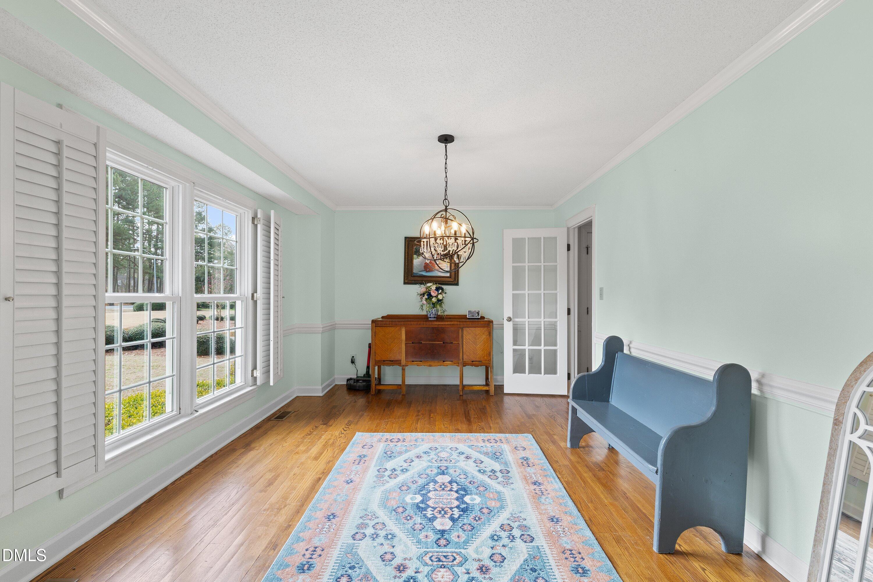 2500 Cravenridge Road Garner, NC 27529 - Photo 8 of 52 a bedroom with furniture and a wooden floor