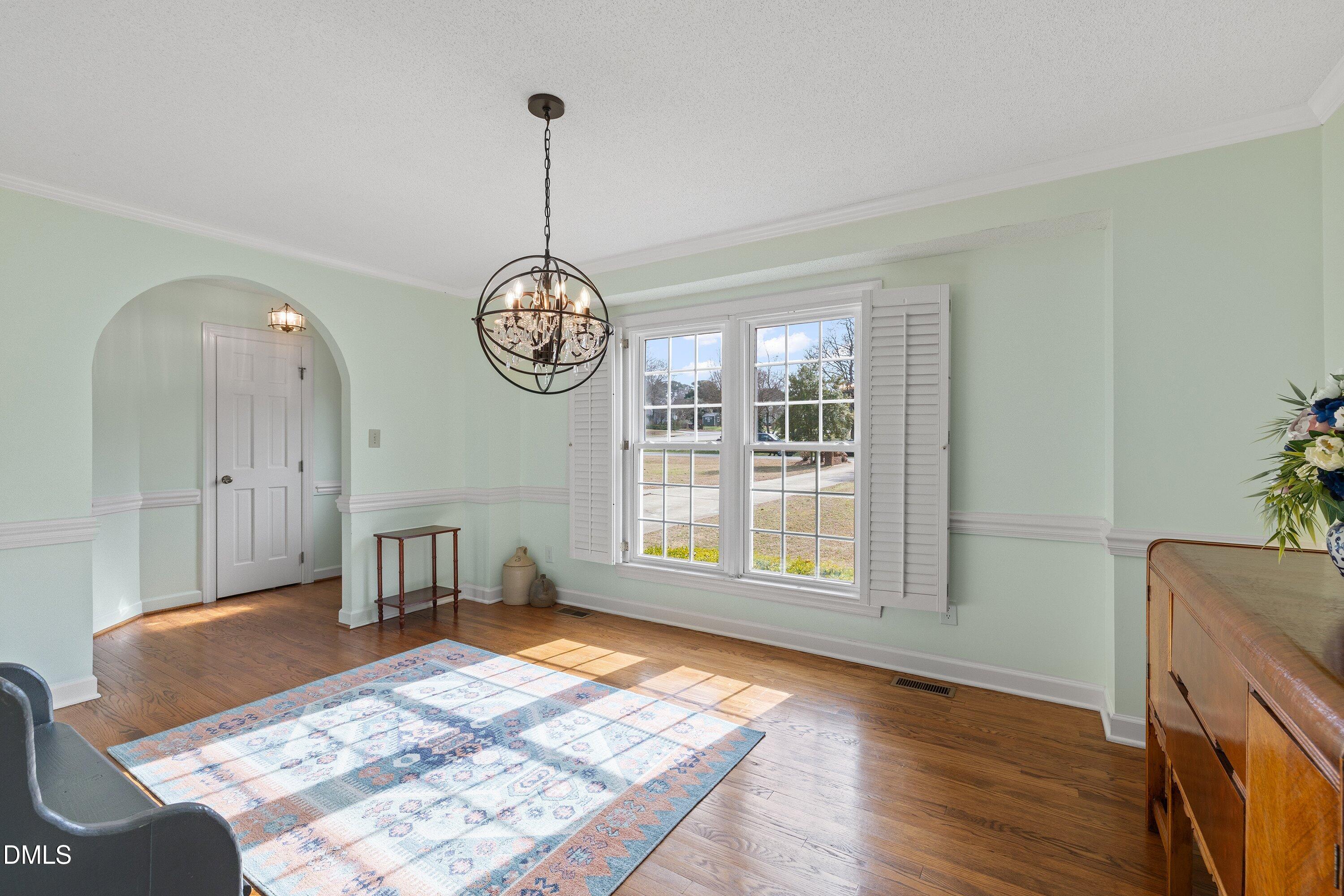 2500 Cravenridge Road Garner, NC 27529 - Photo 9 of 52 a view of an empty room with window and wooden floor