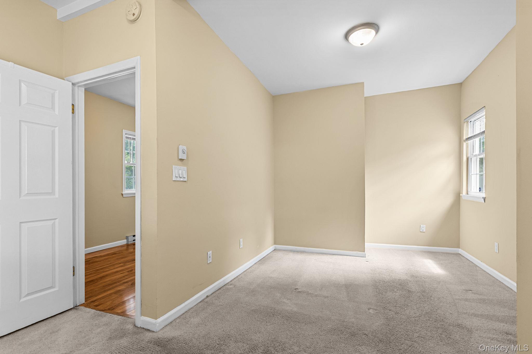 10 Batavia Road Patterson, NY 12563 - Photo 10 of 42 Neutral-toned walls and light-colored carpeting define this bedroom. Built-in closet and previously accomodated a Queen size bedroom set.