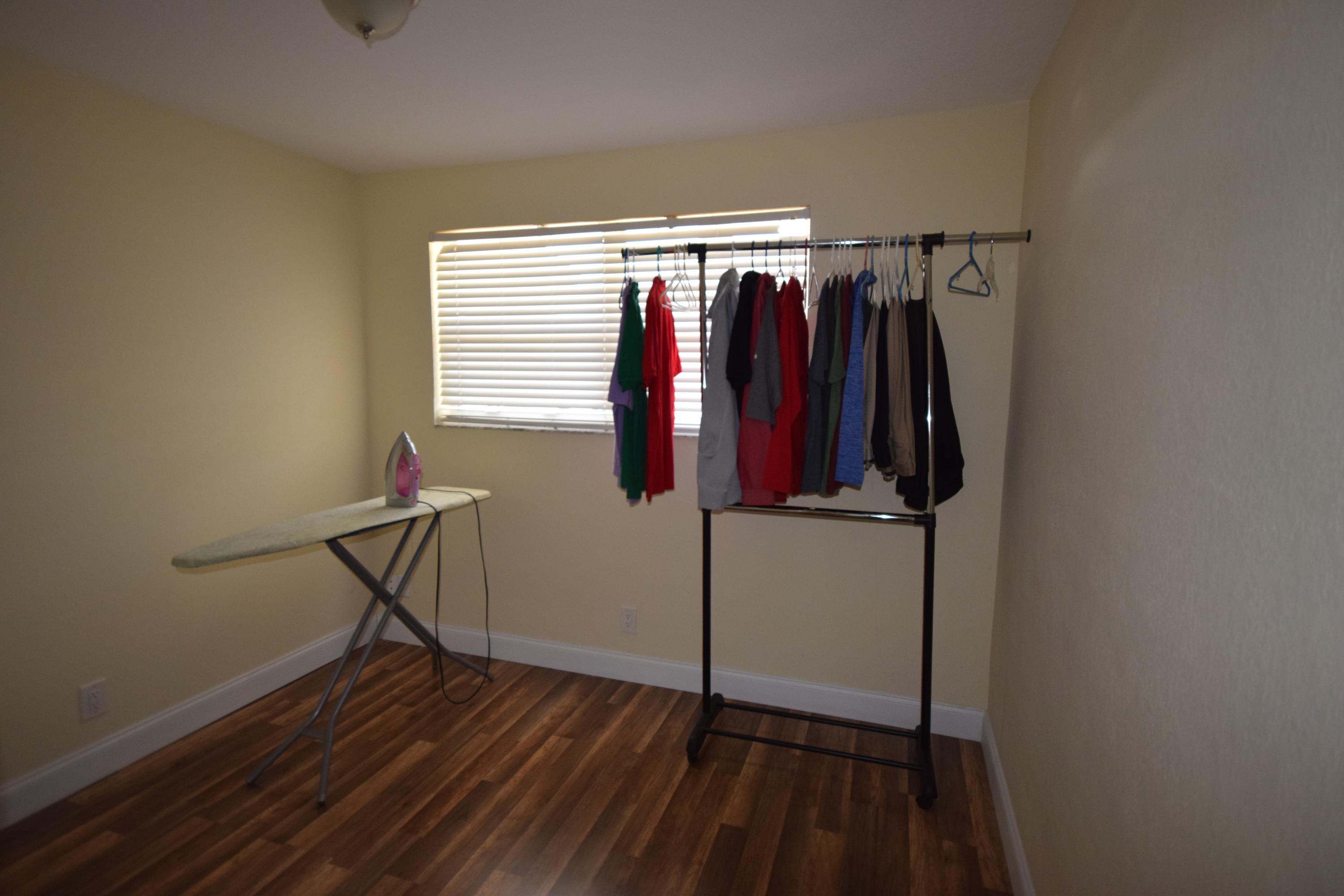 4710 Northwest 3rd Avenue Boca Raton, FL 33431 - Photo 12 of 17 a view of walk in closet with clothes
