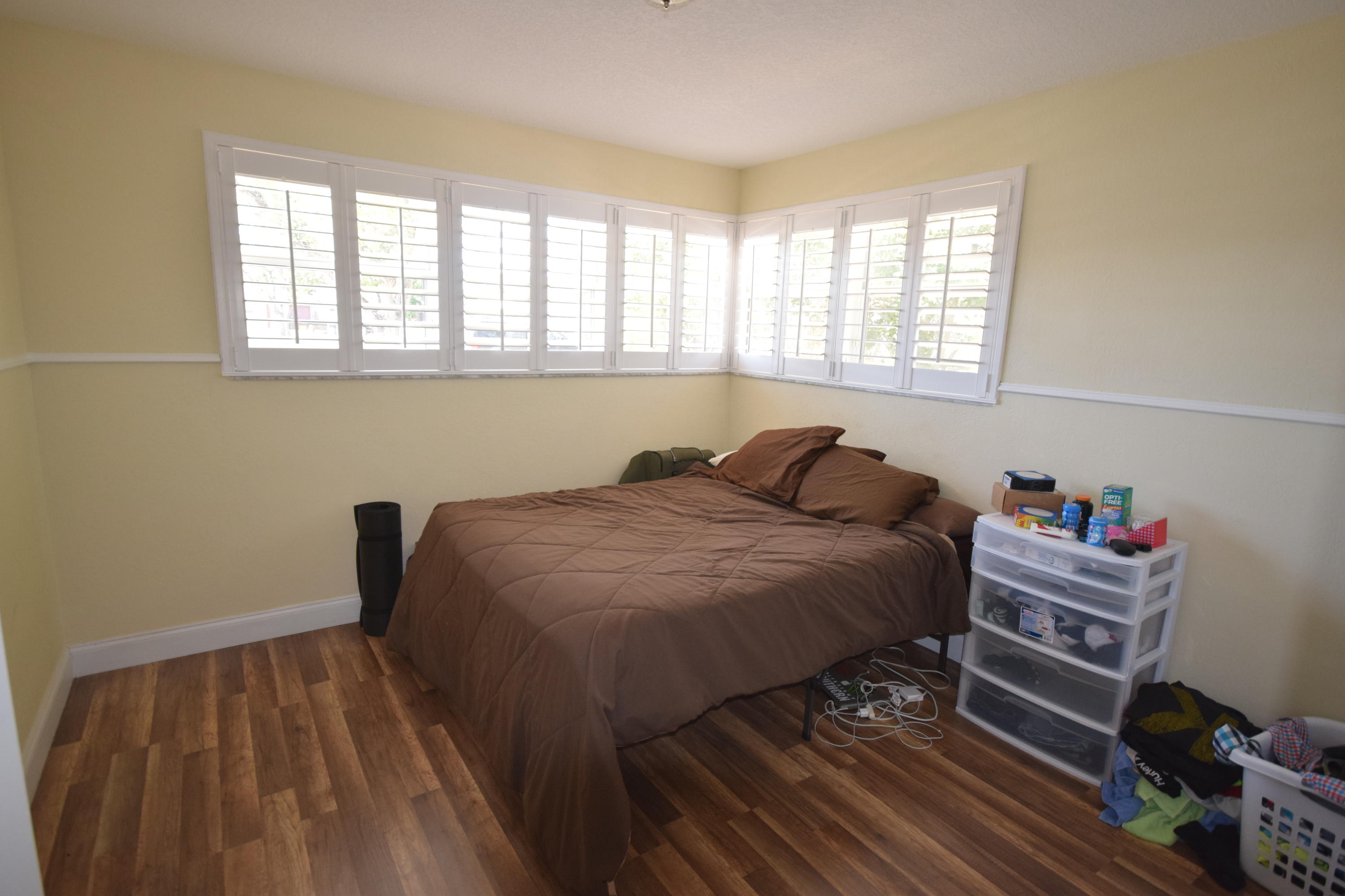 4710 Northwest 3rd Avenue Boca Raton, FL 33431 - Photo 13 of 17 a bedroom with a bed and a window