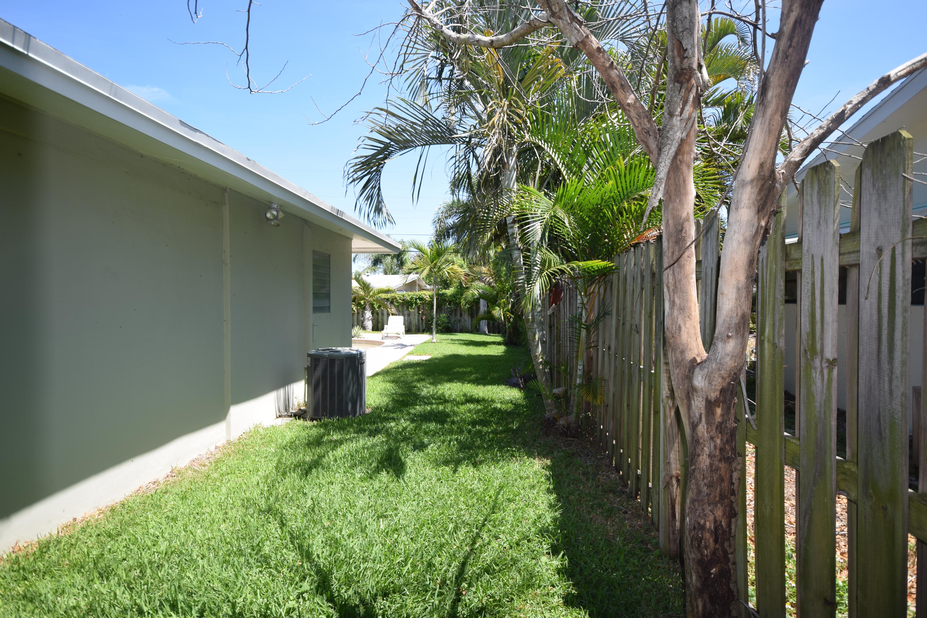 4710 Northwest 3rd Avenue Boca Raton, FL 33431 - Photo 17 of 17 a backyard of a house with lots of green space