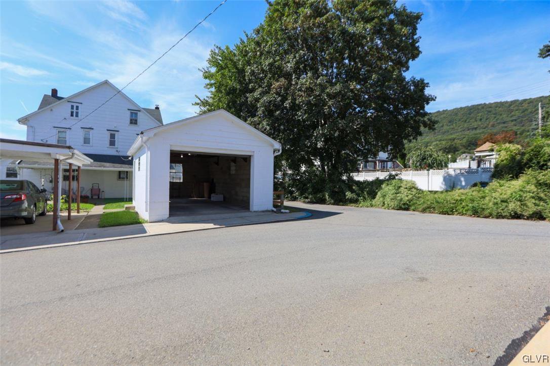 12 B Street Pen Argyl, PA 18072 - Photo 20 of 50 a front view of a house with a yard and garage