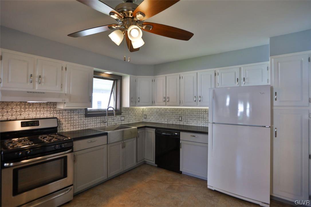 12 B Street Pen Argyl, PA 18072 - Photo 27 of 50 a kitchen with a sink stainless steel appliances and white cabinets