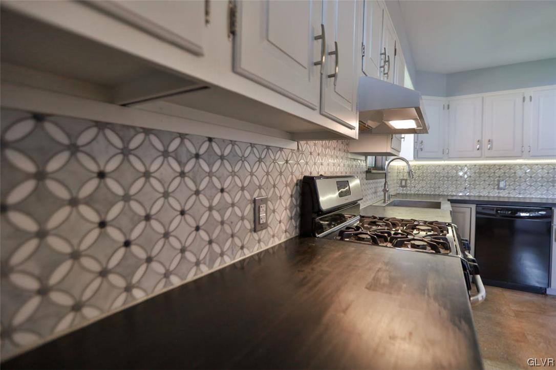 12 B Street Pen Argyl, PA 18072 - Photo 29 of 50 a kitchen with a sink a stove and cabinets