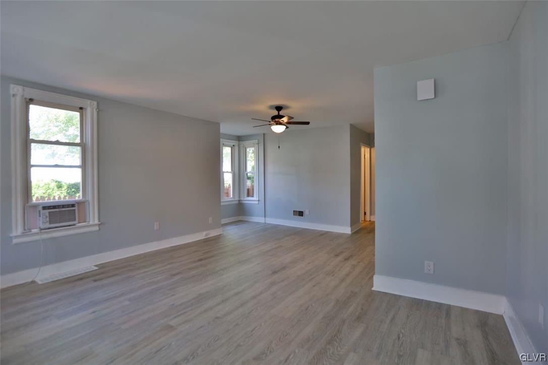 12 B Street Pen Argyl, PA 18072 - Photo 3 of 50 a view of an empty room with wooden floor and a window