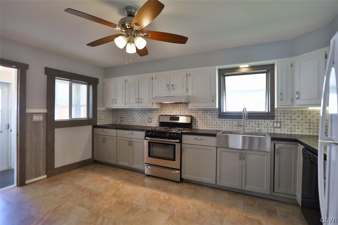 12 B Street Pen Argyl, PA 18072 - Photo 35 of 50 a kitchen with a stove cabinets and window