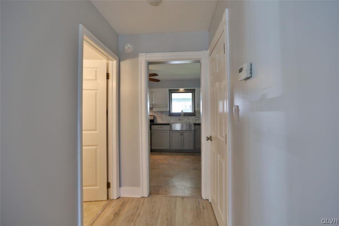12 B Street Pen Argyl, PA 18072 - Photo 37 of 50 a view of a hallway with wooden floor and a bathroom