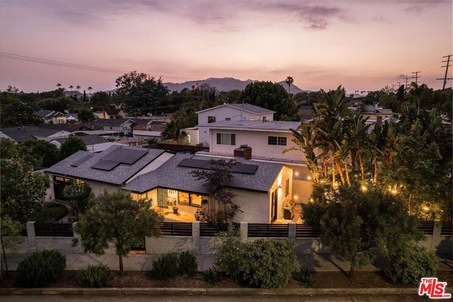 a view of a houses with a city skyline