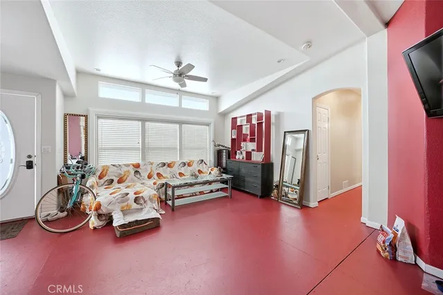 a room with lots of gym equipment and a large window