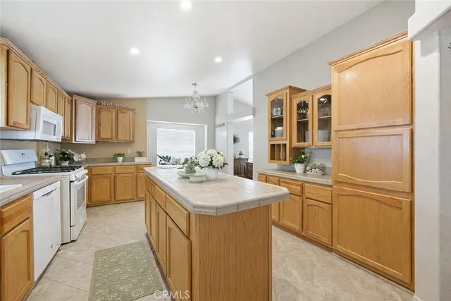a kitchen with a sink stove and refrigerator
