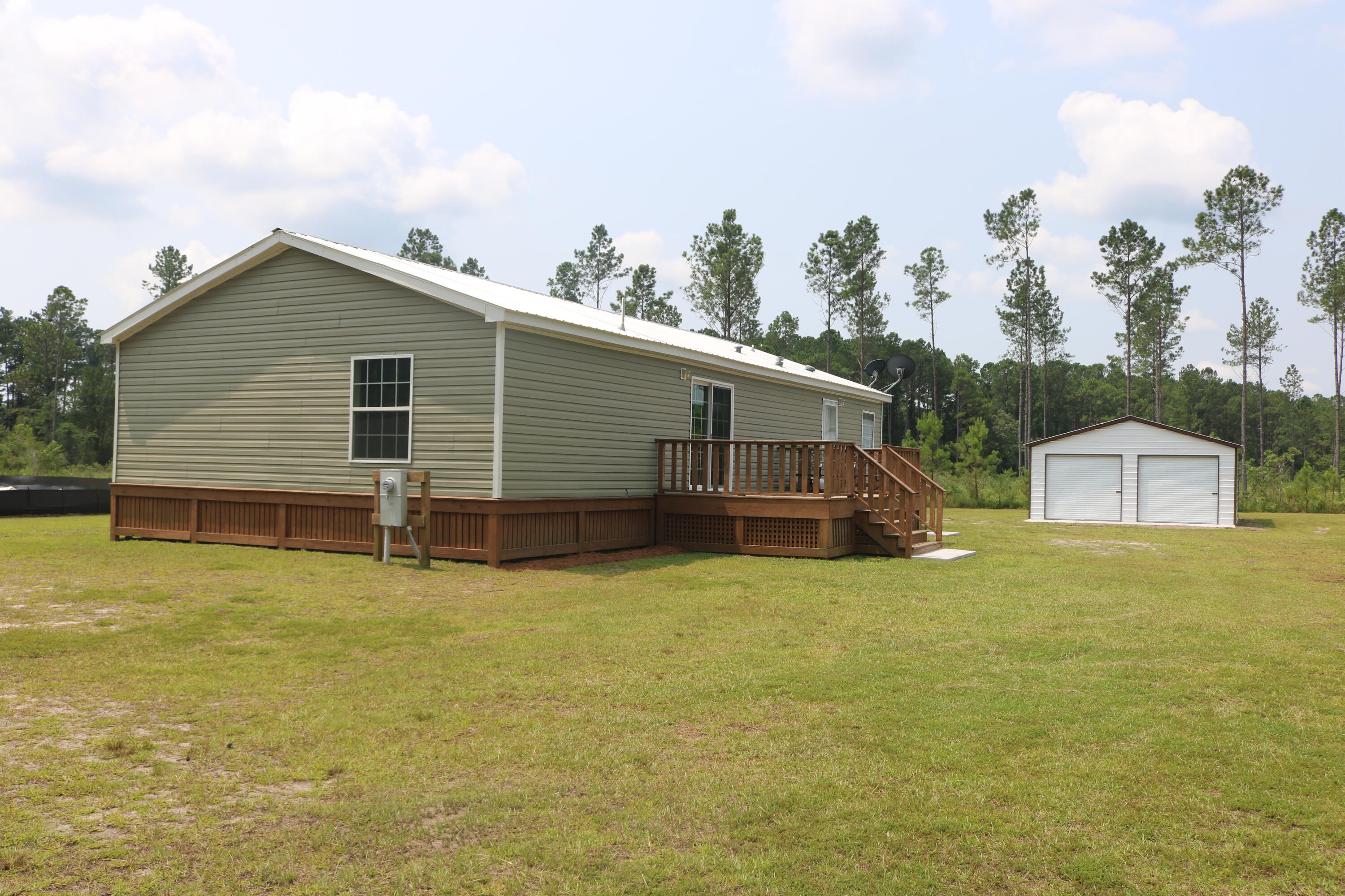 10040 State Rd S-10-1336 McClellanville, SC 29458 - Photo 23 of 26 Back Yard From The Pond View