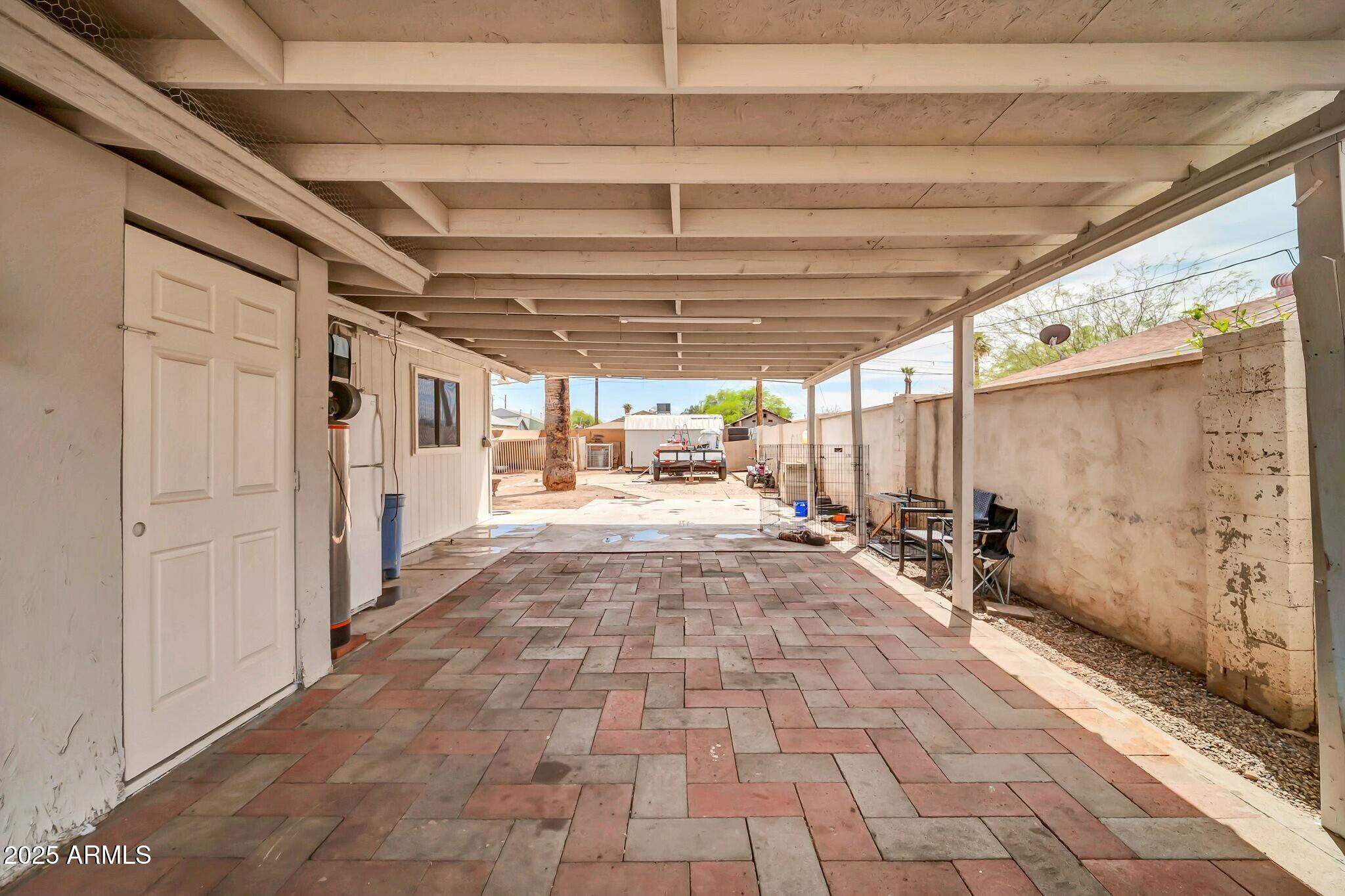 2929 West Granada Road Phoenix, AZ 85009 - Photo 17 of 28 a view of a porch with a table and chairs