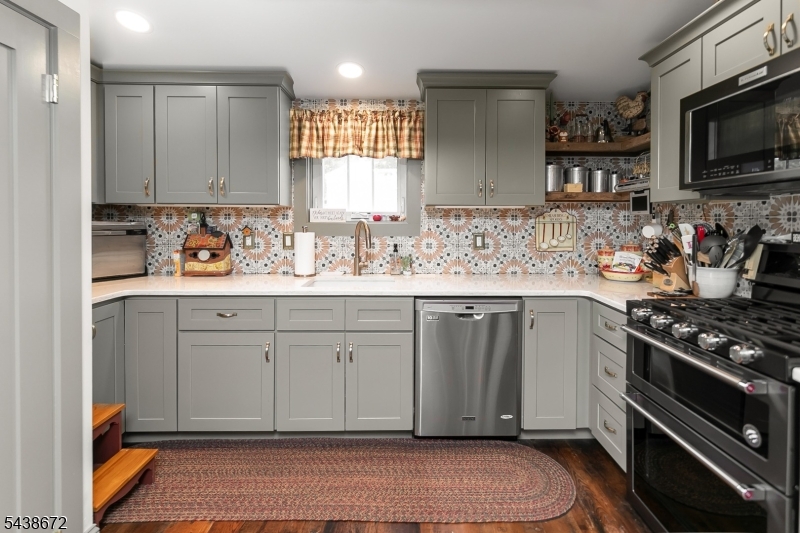 36 Main Street Flanders, NJ 07836 - Photo 6 of 31 a kitchen with sink cabinets and stove top oven