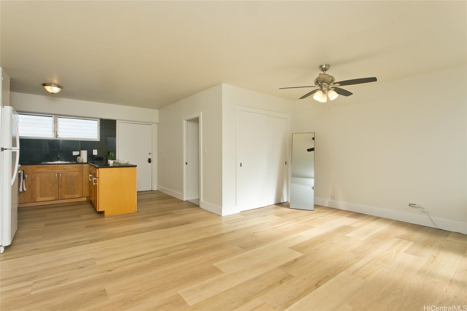 909 University Avenue, Unit 211 Honolulu, HI 96826 - Photo 4 of 10 a view of a kitchen with a sink and a kitchen view