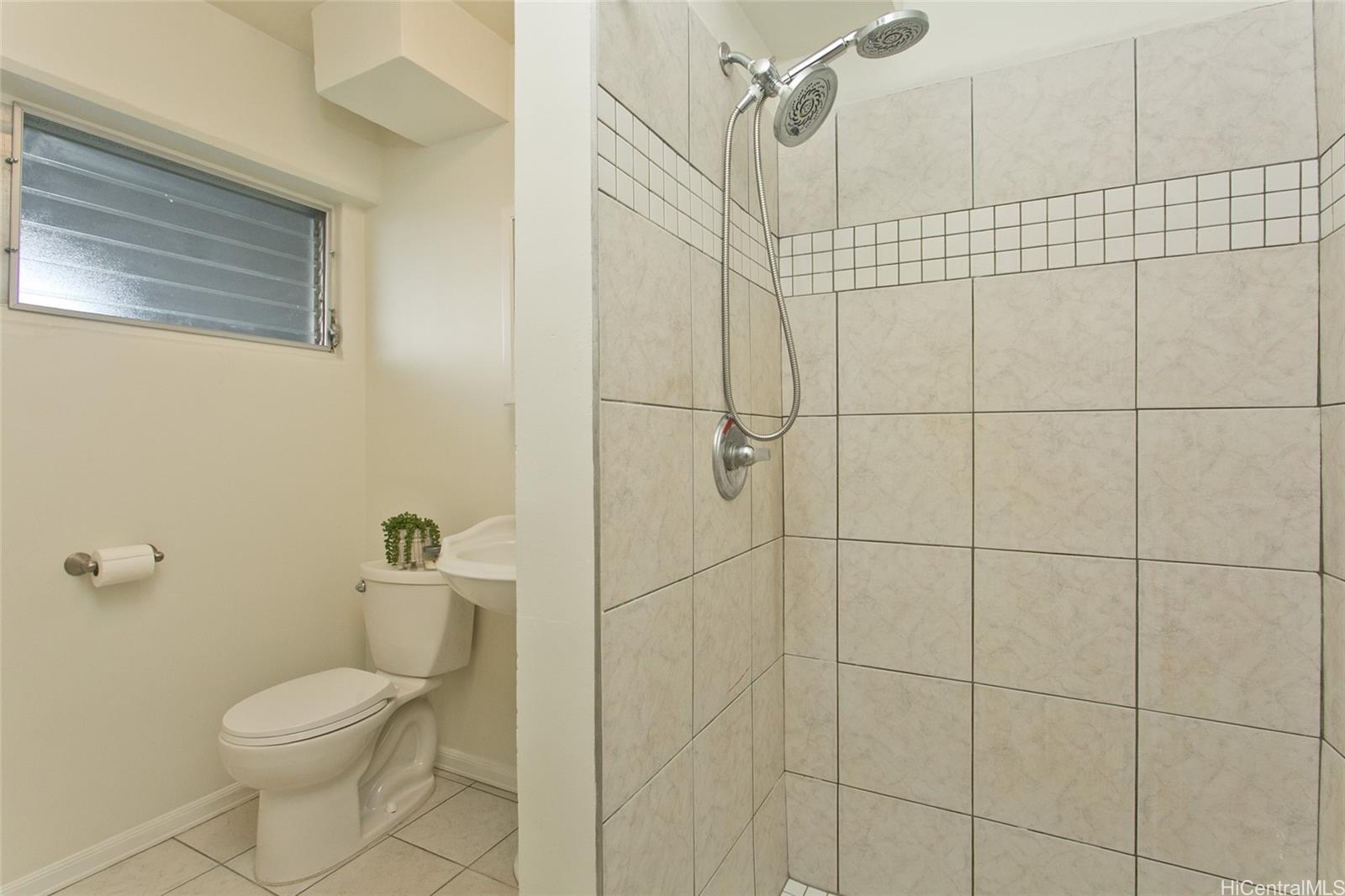 909 University Avenue, Unit 211 Honolulu, HI 96826 - Photo 8 of 10 a bathroom with a toilet and shower