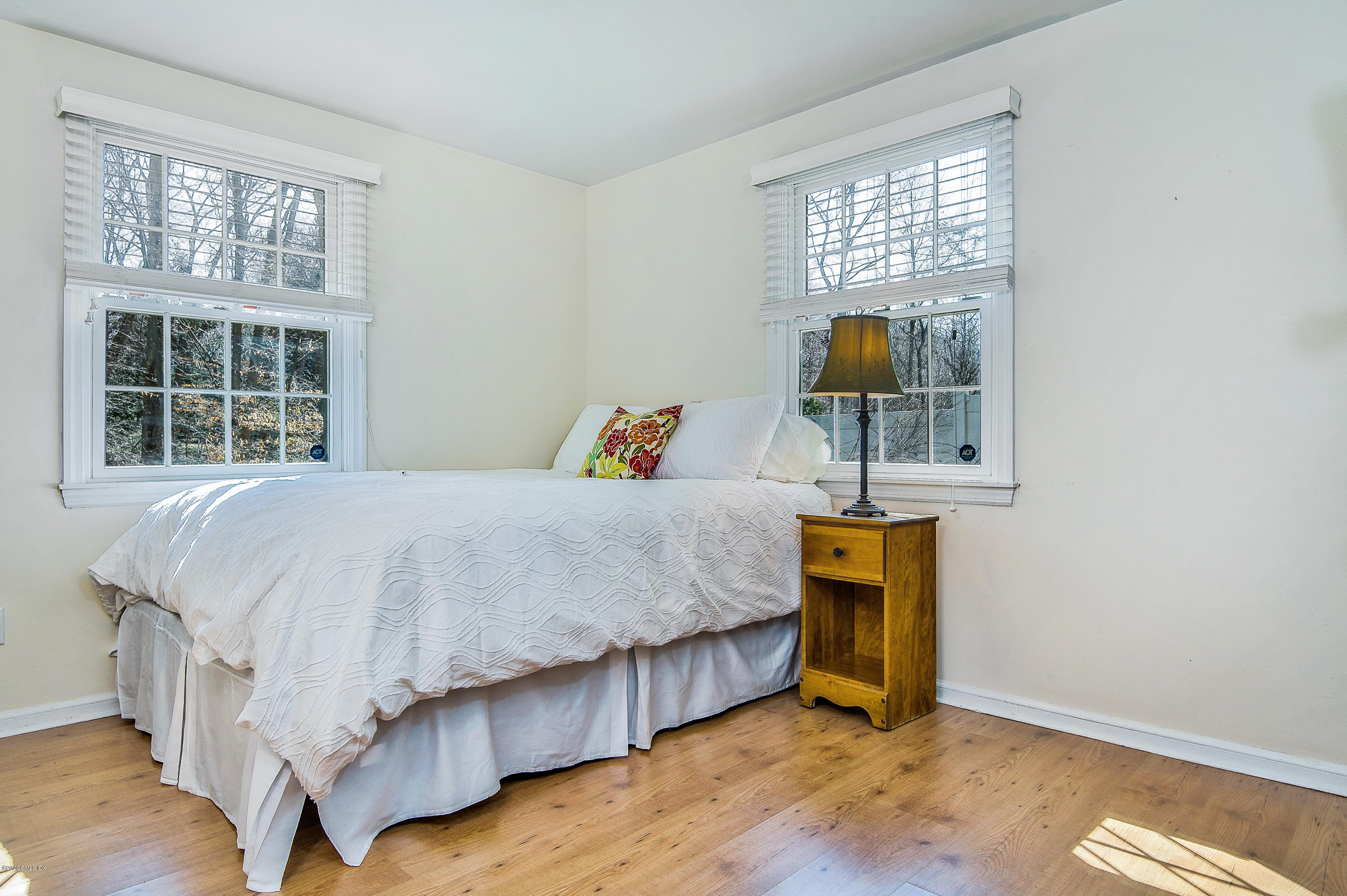 73 Malvern Road Stamford, CT 06905 - Photo 14 of 25 a bedroom with a bed and a window