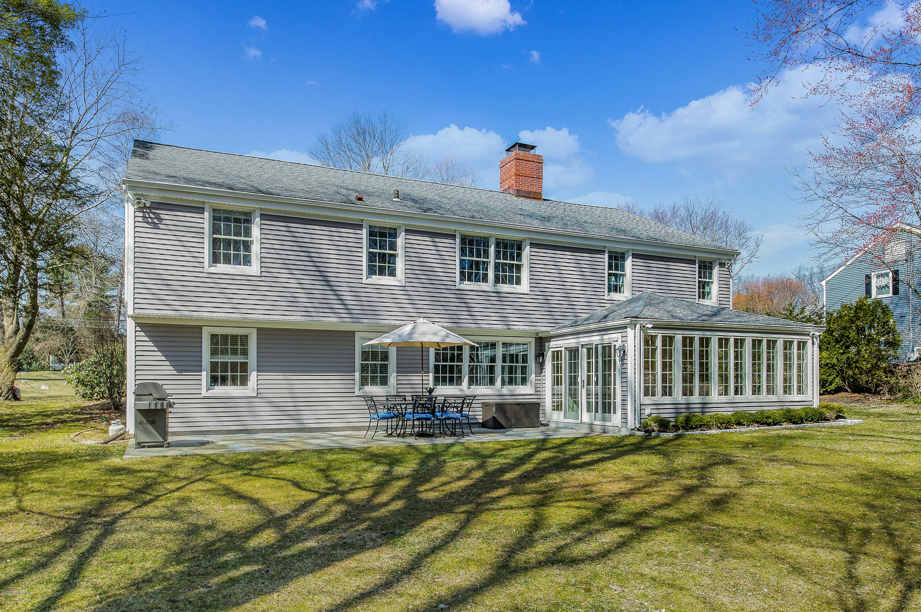 73 Malvern Road Stamford, CT 06905 - Photo 19 of 25 a front view of a house with a yard