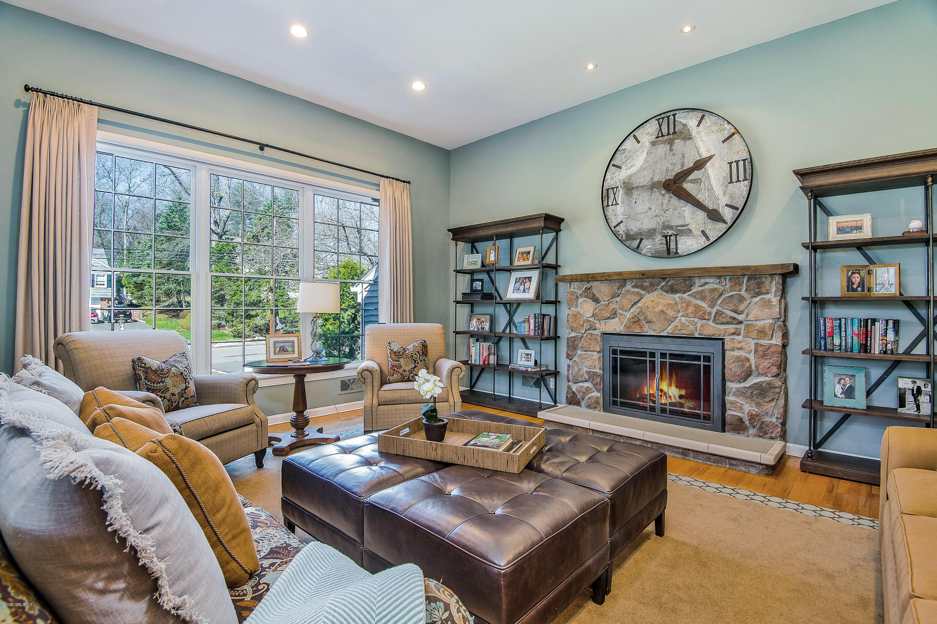 73 Malvern Road Stamford, CT 06905 - Photo 2 of 25 a living room with furniture and a fireplace