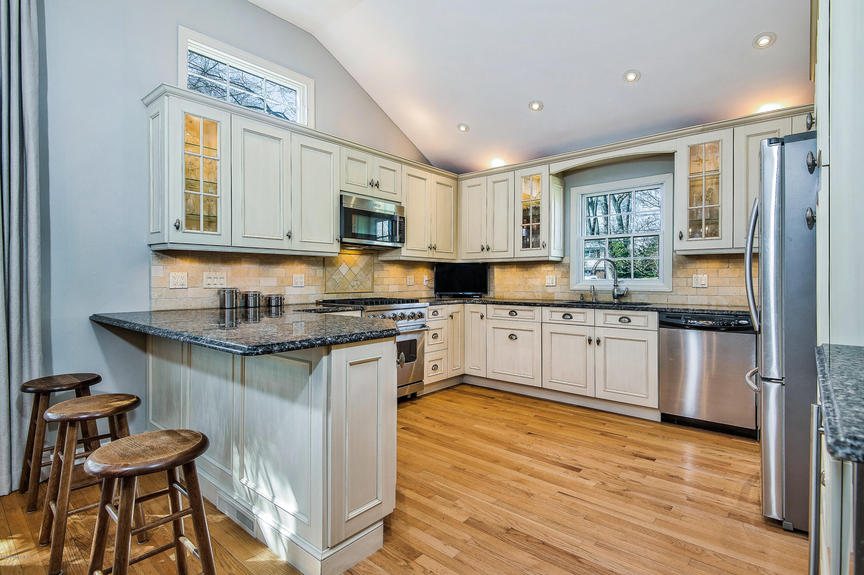 73 Malvern Road Stamford, CT 06905 - Photo 4 of 25 a kitchen with granite countertop a sink cabinets and window