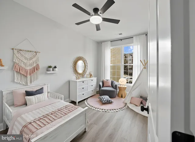 a bed room with a bed and a chandelier