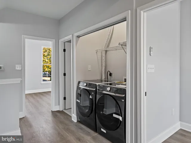 a view of an entryway with wooden floor
