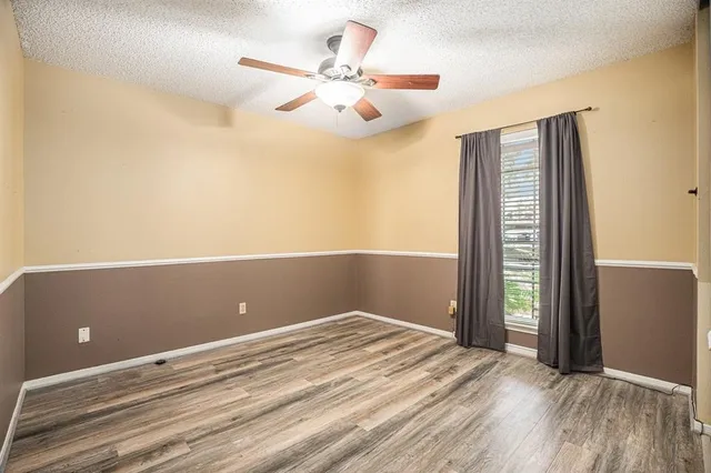 wooden floor and window in an empty room