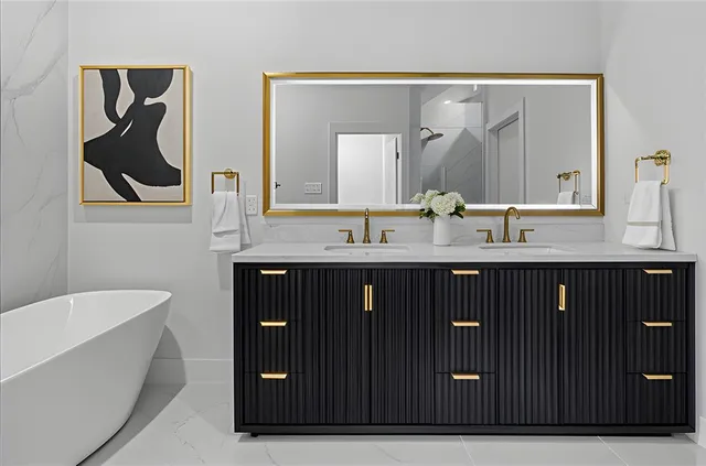 a bathroom with a double vanity sink and mirror