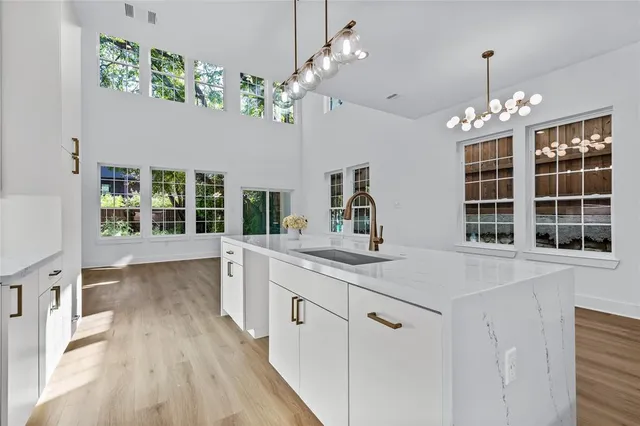 a view of kitchen with granite countertop cabinets a sink and dishwasher