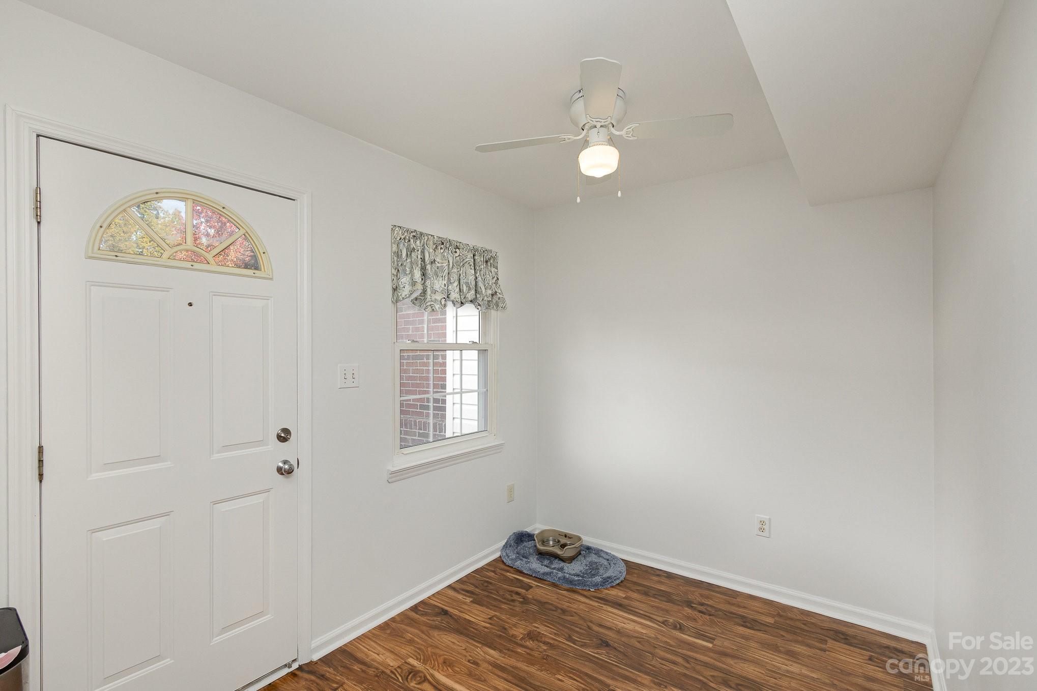 10927 Park Road Charlotte, NC 28226 - Photo 13 of 28 a view of wooden floor and windows in a room