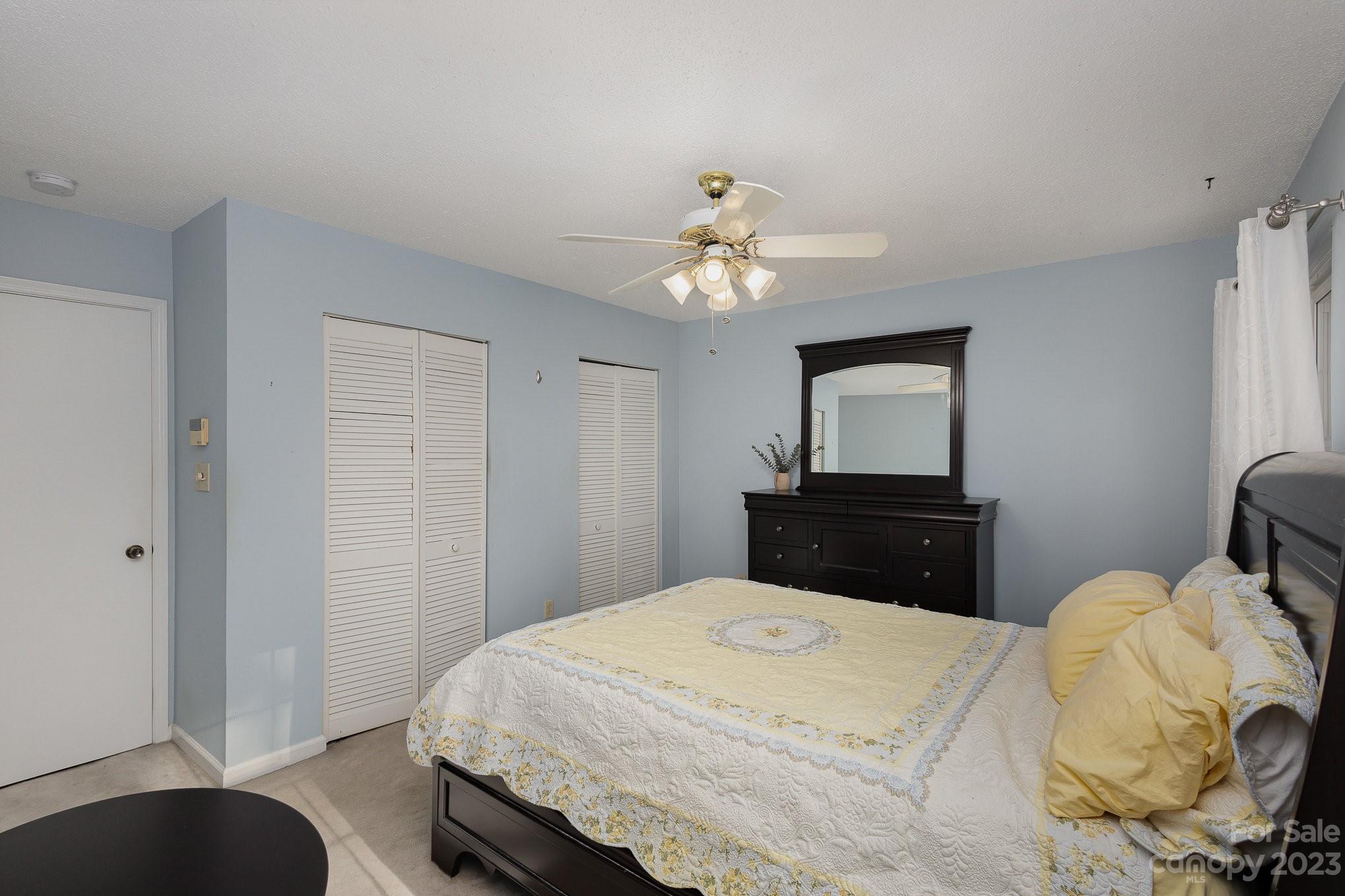 10927 Park Road Charlotte, NC 28226 - Photo 19 of 28 a bedroom with a bed and a tv