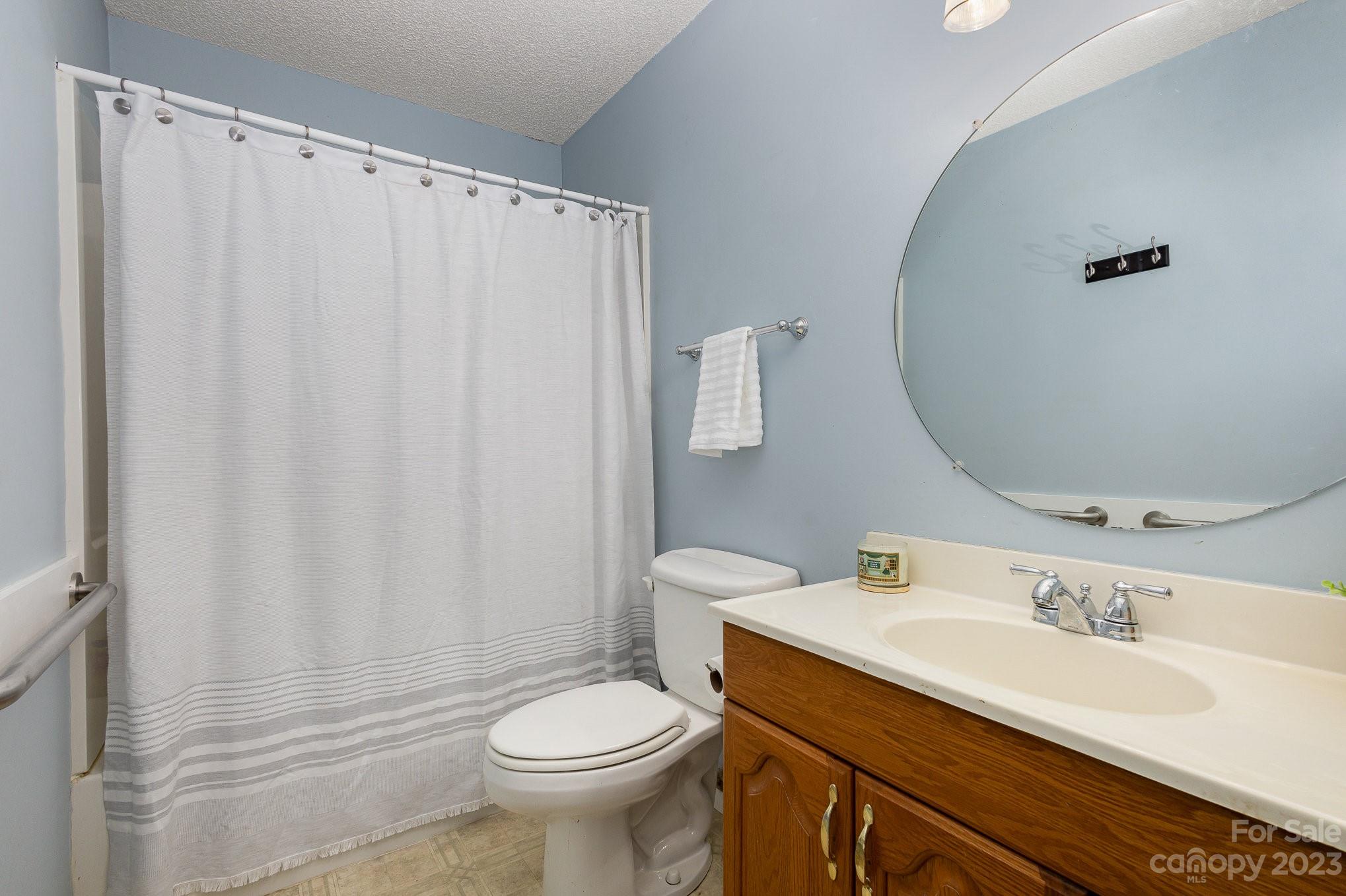 10927 Park Road Charlotte, NC 28226 - Photo 20 of 28 a bathroom with a sink toilet and shower