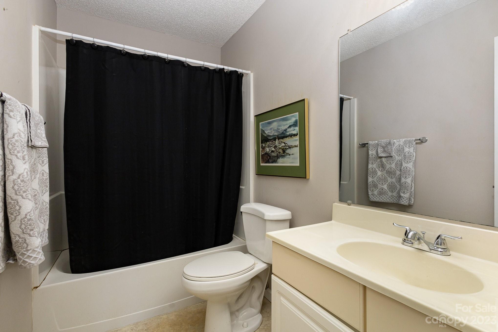 10927 Park Road Charlotte, NC 28226 - Photo 21 of 28 a bathroom with a sink and a toilet