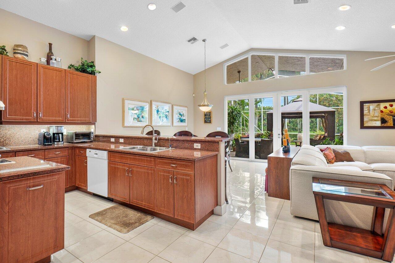 9031 Long Lake Palm Drive Boca Raton, FL 33496 - Photo 13 of 53 a living room with granite countertop furniture and a kitchen counter top