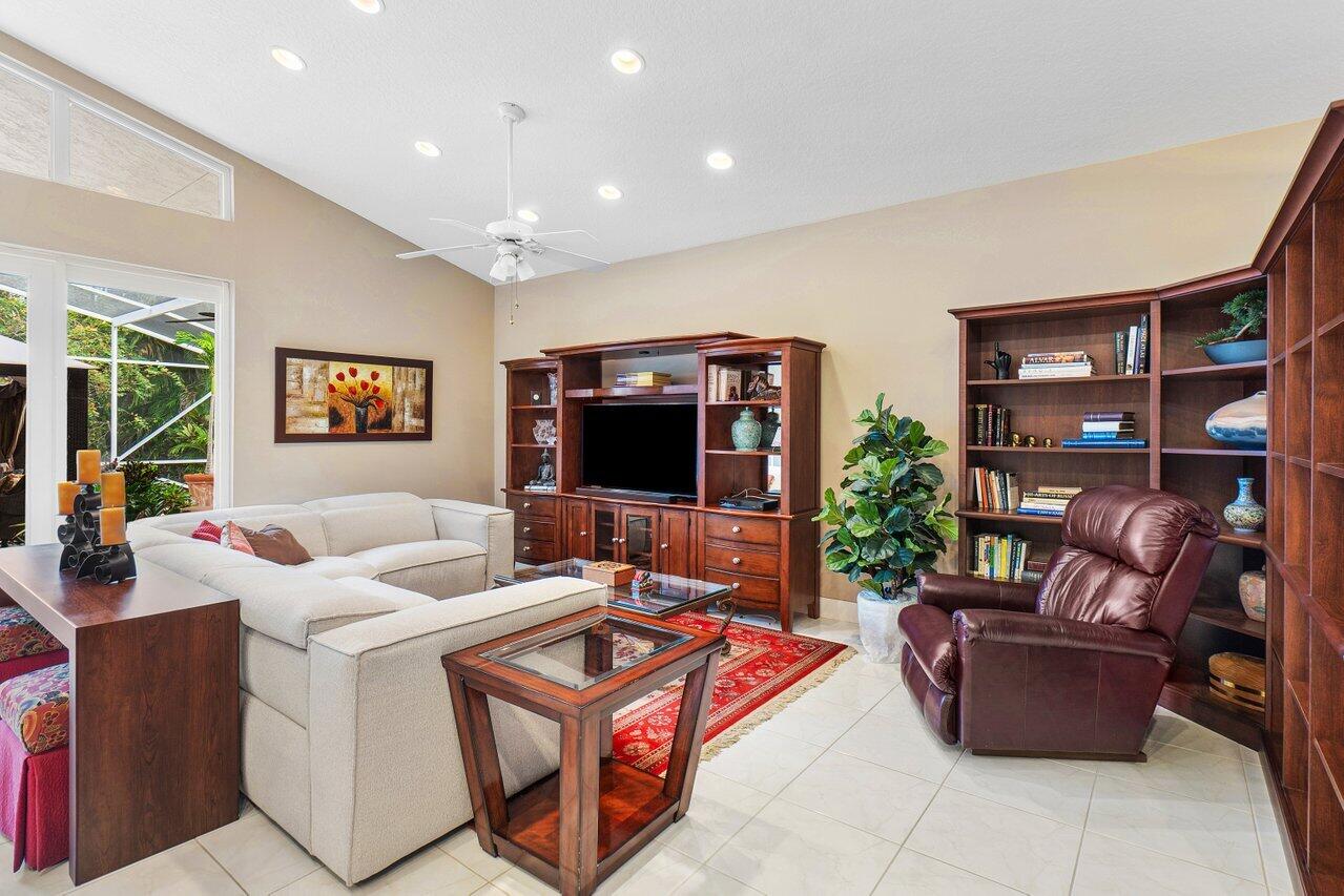 9031 Long Lake Palm Drive Boca Raton, FL 33496 - Photo 16 of 53 a living room with furniture and a flat screen tv