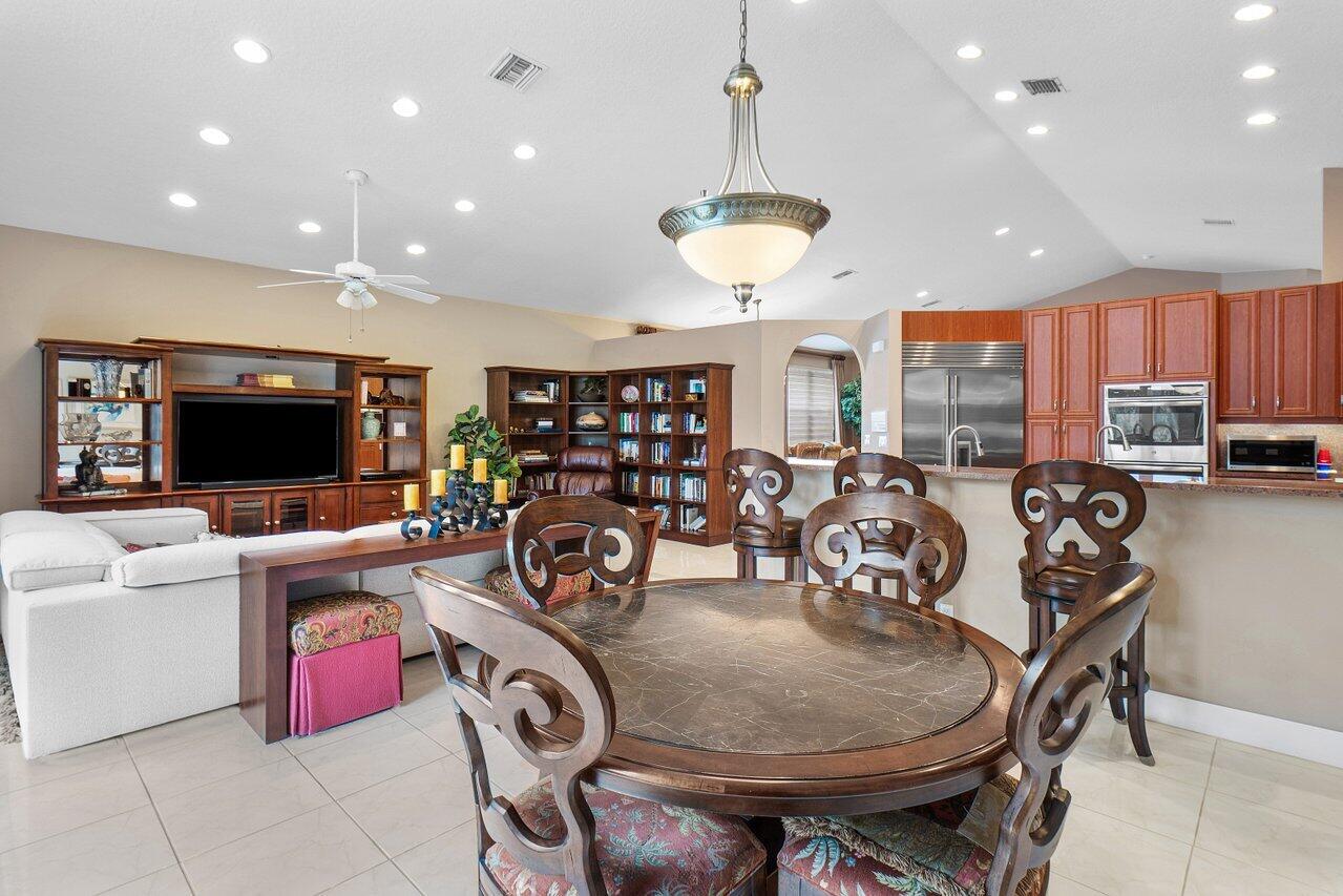 9031 Long Lake Palm Drive Boca Raton, FL 33496 - Photo 21 of 53 a view of a dining room with furniture