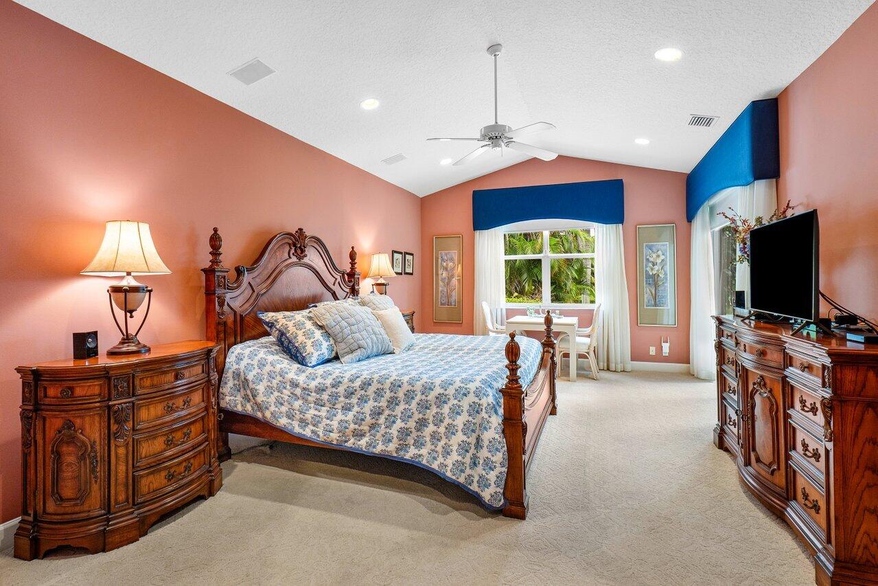 9031 Long Lake Palm Drive Boca Raton, FL 33496 - Photo 22 of 53 a bedroom with furniture and a flat screen tv