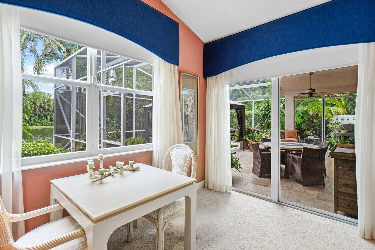 9031 Long Lake Palm Drive Boca Raton, FL 33496 - Photo 25 of 53 a view of a dining room with furniture window and outside view