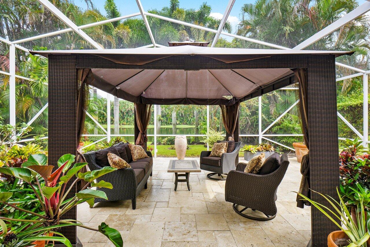9031 Long Lake Palm Drive Boca Raton, FL 33496 - Photo 29 of 53 a view of backyard with outdoor seating and plants