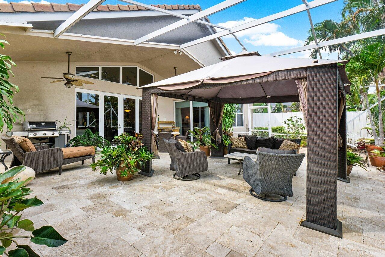 9031 Long Lake Palm Drive Boca Raton, FL 33496 - Photo 30 of 53 a view of a patio with chairs and plants